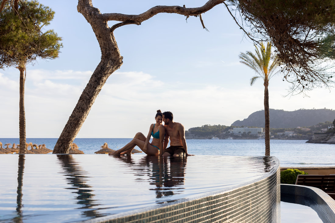 Couple relaxing in pool at all-inclusive resort