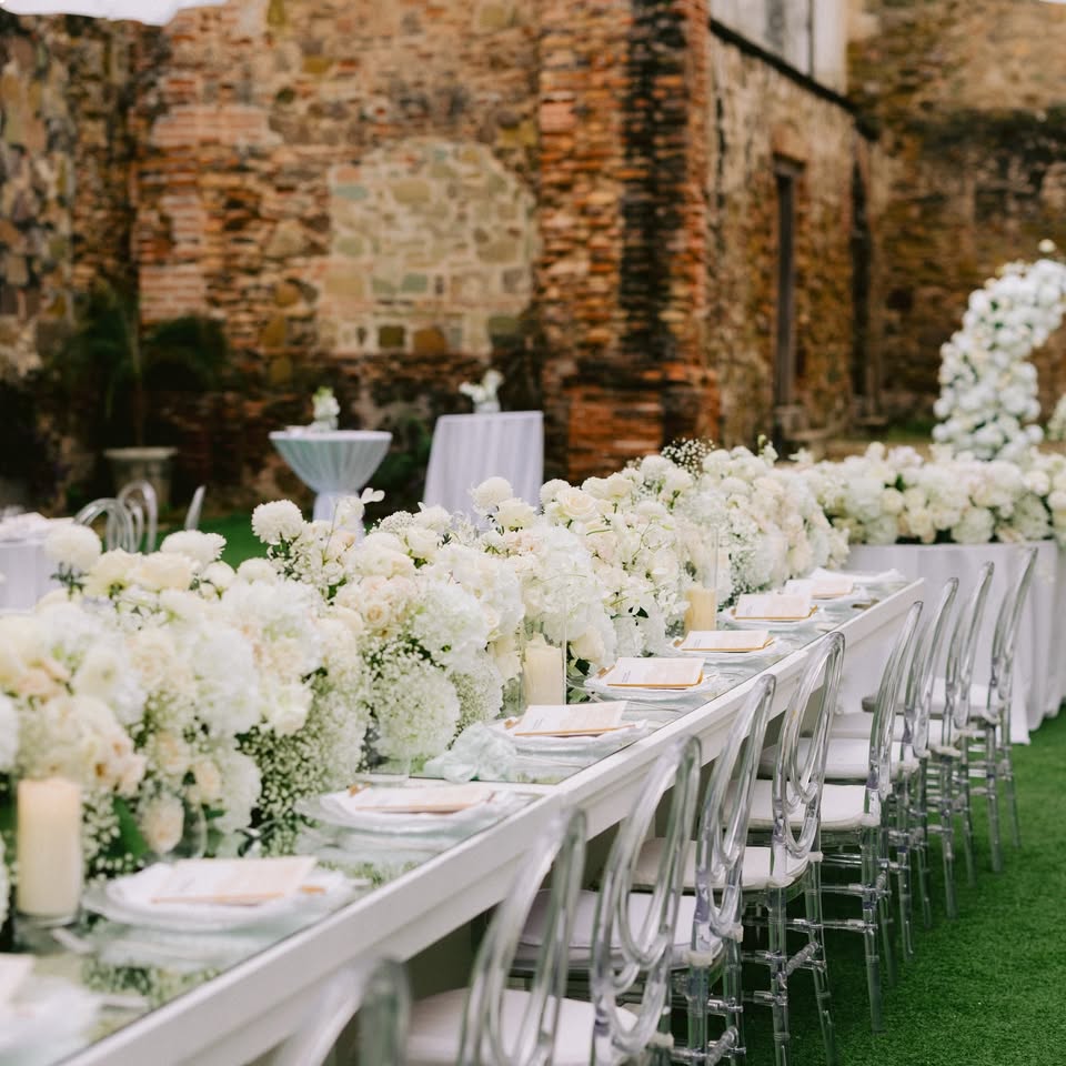 Destination wedding reception table with floral centerpiece